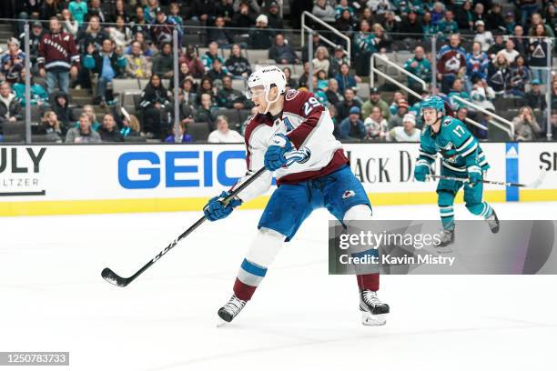 Nathan MacKinnon of the Colorado Avalanche scores the game-winning goal in overtime against the San Jose Sharks at SAP Center on April 4, 2023 in San...