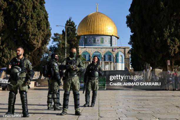 Members of Israeli security forces guard the Al-Aqsa Mosque compound following clashes that erupted during Islam's holy fasting month of Ramadan in...