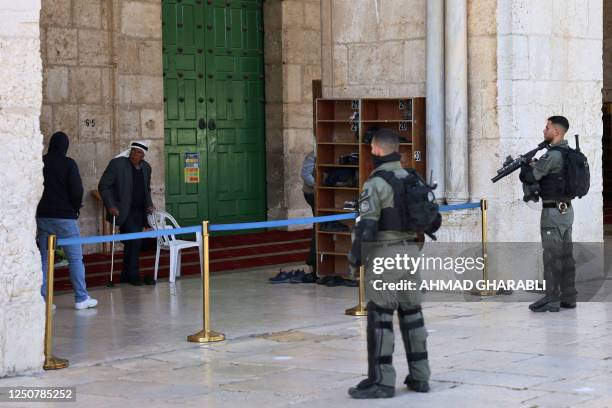 Israeli security forces stand guard outside the Al-Aqsa mosque in Jerusalem's Old City, early on April 5, 2023 during Islam's holy month of Ramadan....