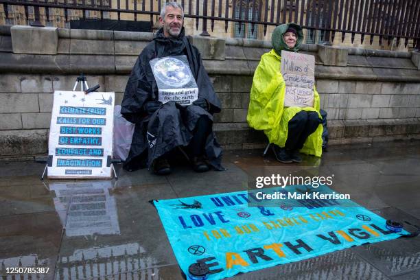 Climate activists from Extinction Rebellion maintain an Earth Vigil outside the Houses of Parliament on 8 March 2023 in London, United Kingdom....