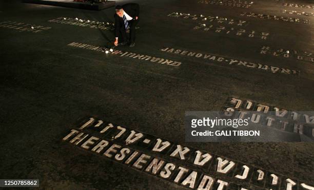 Jewish Australian Holocaust survivor Solomon Susskind who was saved by Oscar Schindler's list places a flower at the Hall of Remembrance where the...