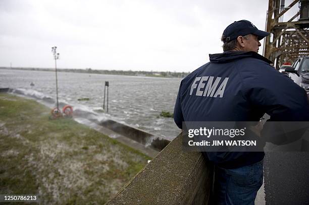 New Orleans Parish FEMA representative Jim Hufft surveys the area on a bridge over the Industrial Canal in New Orleans, Louisiana, September 1, 2008...