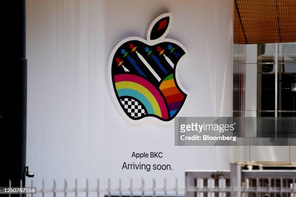 Sign reading 'Arriving soon' with an Apple Inc. Logo at its store ahead of opening in the Jio World Drive shopping center at Bandra Kurla Complex in...