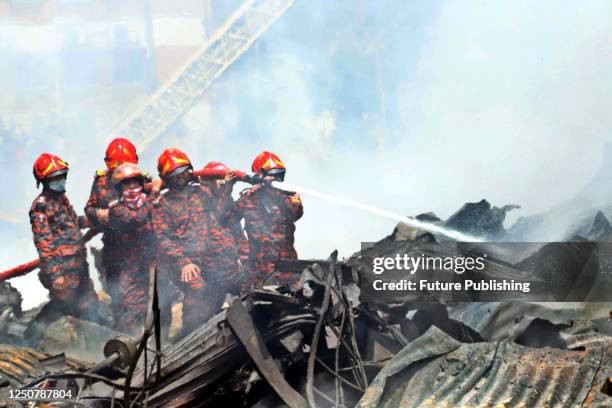 April 04 Dhaka, Bangladesh: Army, navy and air force join to support firefighters to control the fire. The flames has burned a large part of a...
