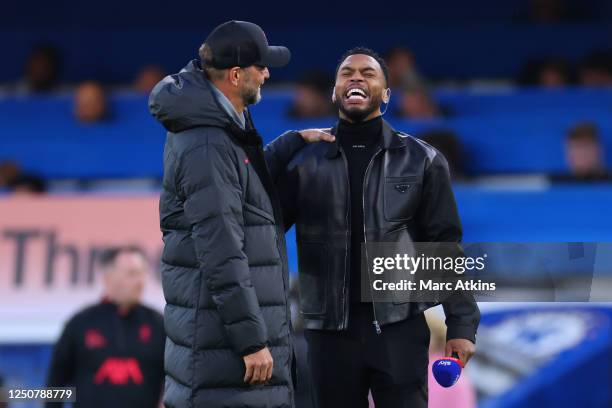 Jurgen Klopp manager of Liverpool with former Liverpool players Daniel Sturridge during the Premier League match between Chelsea FC and Liverpool FC...