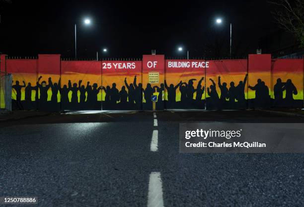 New mural painted on to the so called Peace Wall gates that separates the catholic and protestant communities can be seen on April 3, 2023 in...