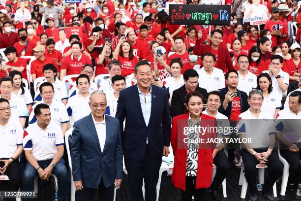 Thai candidates for prime minister Paetongtarn Shinawatra , Srettha Thavisin and Chaikasem Nitisiri take part in an election rally for Thailand's...