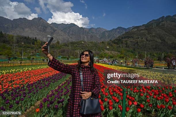 Tourist takes a selfie using a mobile phone at Tulip Garden, claimed to be Asia's largest, in Srinagar on April 5, 2023.
