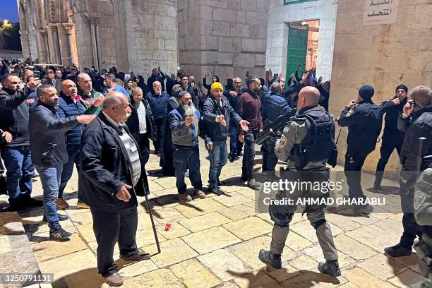 Palestinians confront Israeli security forces inside Jerusalem's al-Aqsa mosque compound early on April 5, 2023 during the Muslim holy month of...