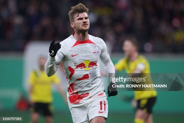 Leipzig's German forward Timo Werner celebrates scoring the opening goal with his teammates during the German Cup quarter-final football match RB...