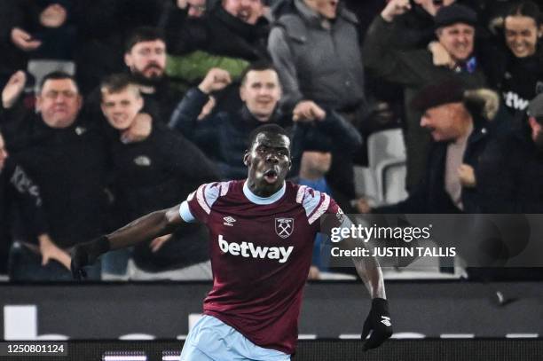West Ham United's French defender Kurt Zouma celebrates his team first goal during the English Premier League football match between West Ham United...