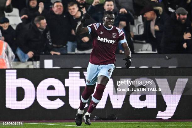 West Ham United's French defender Kurt Zouma celebrates his team first goal during the English Premier League football match between West Ham United...