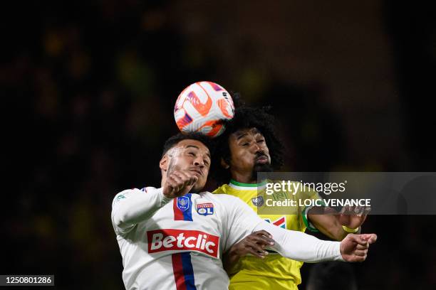 Lyon's Croatian defender Dejan Lovren fights for the ball with Nantes' Congolese midfielder Samuel Moutoussamy during the French Cup semi-final...