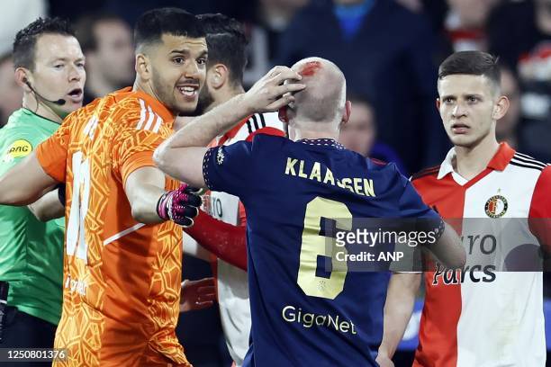 Davy Klaassen of Ajax is hit by an object during the Semifinal of the TOTO KNVB Cup match between Feyenoord and Ajax at Feyenoord Stadion de Kuip on...