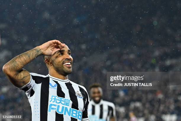 Newcastle United's English striker Callum Wilson celebrates after scoring his team third goal during the English Premier League football match...