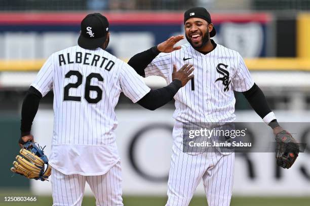 Hanser Alberto of the Chicago White Sox and Elvis Andrus celebrate after defeating the San Francisco Giants 7-3 at Guaranteed Rate Field on April 05,...
