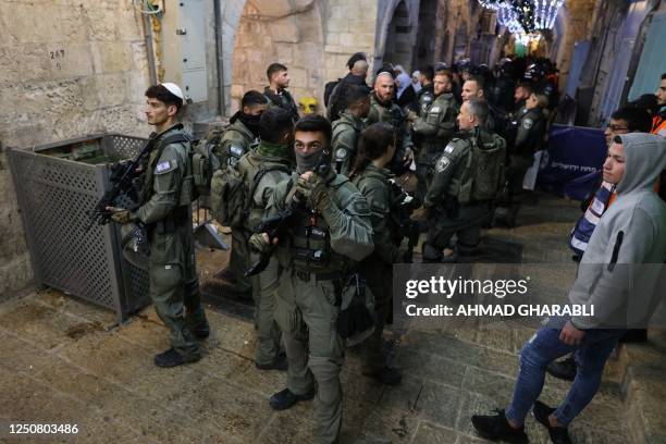 Israeli security forces are seen during the expulsion of worshipers from Al-Aqsa mosque compound in Jerusalem's Old City following clashes with...