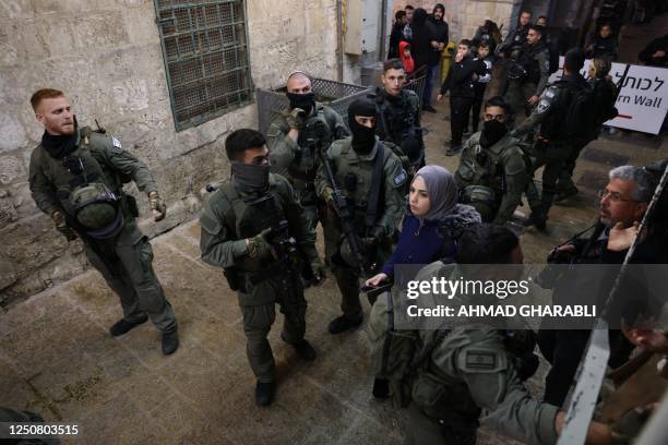 Israeli security forces are seen during the expulsion of worshipers from Al-Aqsa mosque compound in Jerusalem's Old City following clashes with...