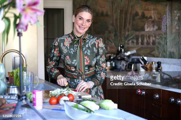 Claudelle Deckert cooks in the kitchen of her and Peter Olssons home during a photo shoot on April 4, 2023 in Amsterdam, Netherlands.