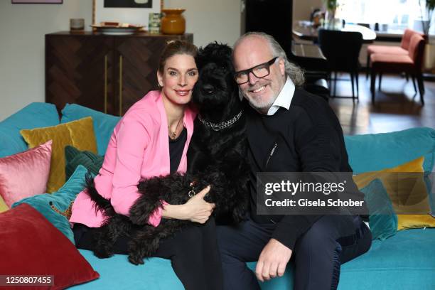 Claudelle Deckert and Peter Olsson pose with their dog Bowie and dog Hilda during a photo shoot on April 4, 2023 in Amsterdam, Netherlands.