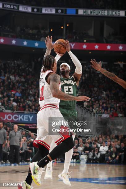 Wesley Matthews of the Milwaukee Bucks shoots a three point basket during the game against the Chicago Bulls on April 5, 2023 at the Fiserv Forum...