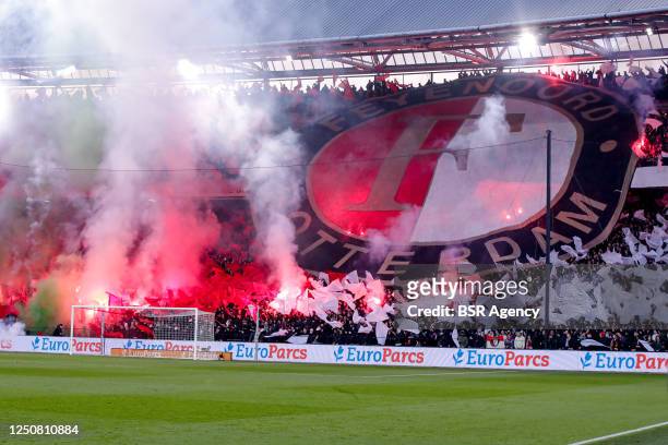 Fans of Feyenoord with fireworks interrupting the game during the TOTO KNVB Cup - Semi-Final match between Feyenoord and Ajax at Stadion Feyenoord on...