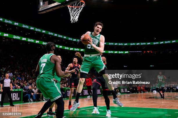 Mike Muscala of the Boston Celtics rebounds the ball during the game against the Toronto Raptors on April 5, 2023 at the TD Garden in Boston,...