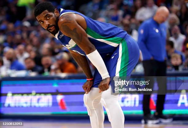 Kyrie Irving of the Dallas Mavericks looks on during a break in the action against the Sacramento Kings in the first half at American Airlines Center...