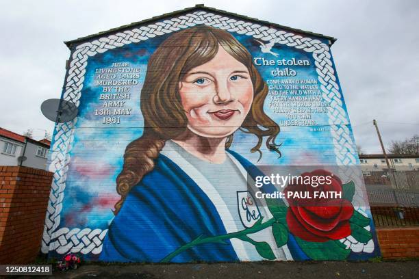 Photograph taken on March 28, 2023 shows a mural, in west Belfast, in tribute to Julie Livingstone, who was killed at 14 years old, by a plastic...