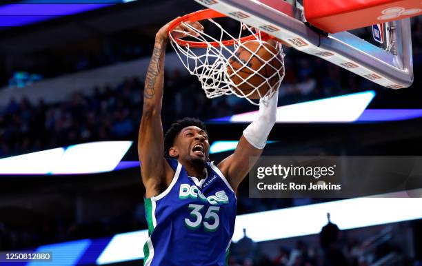 Christian Wood of the Dallas Mavericks slam dunks against the Sacramento Kings in the second half at American Airlines Center on April 5, 2023 in...