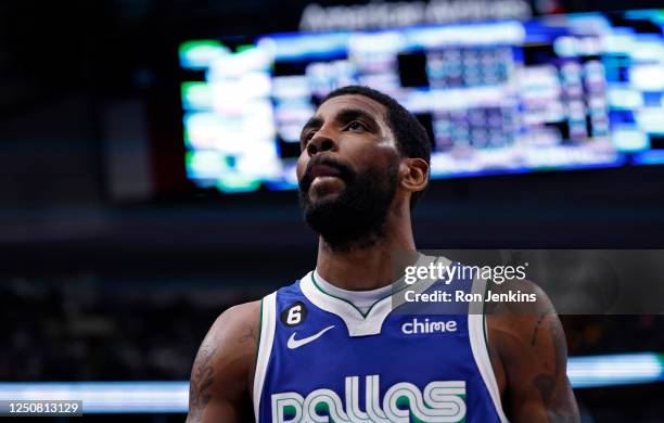 Kyrie Irving of the Dallas Mavericks looks on during a break in the action against the Sacramento Kings in the second half at American Airlines...