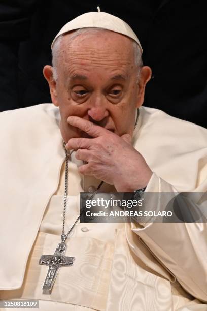 Pope Francis, seated in his wheelchair, ponders as he leaves after presiding over the celebration of Chrism Mass, as part of the Holy Week, on April...