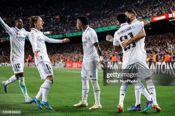 Karim Benzema of Real Madrid celebrates after scoring a goal with Vinicius Jr, Luka Modric, Rodrygo Goes, and Eduardo Camavigna during the semi...