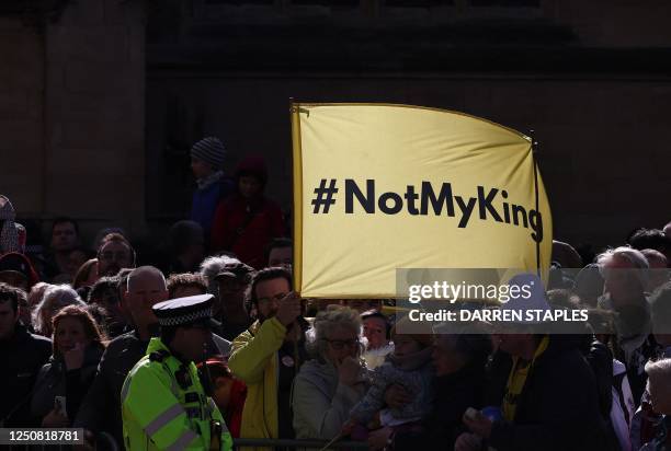 Protester holds up a banner saying 'Not My King' ahead of the arrival of Britain's King Charles III and Britain's Camilla, Queen Consort outside York...