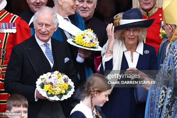 Britain's King Charles III and Britain's Camilla, Queen Consort depart York Minster after the distribution of the Maundy money to 74 men and 74...