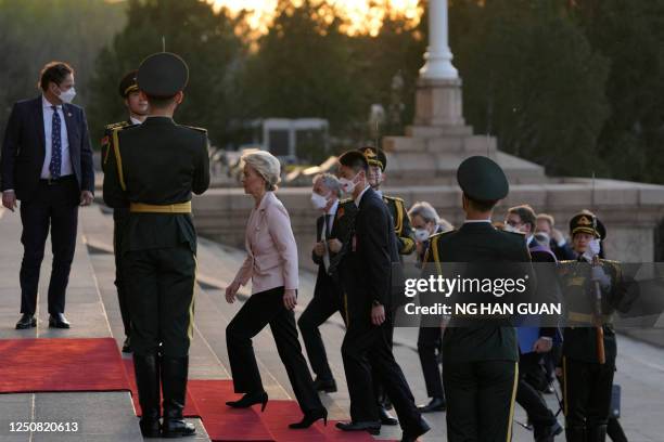 European Commission President Ursula von der Leyen arrives for a meeting with Chinese President Xi Jinping and France's President Emmanuel Macron at...