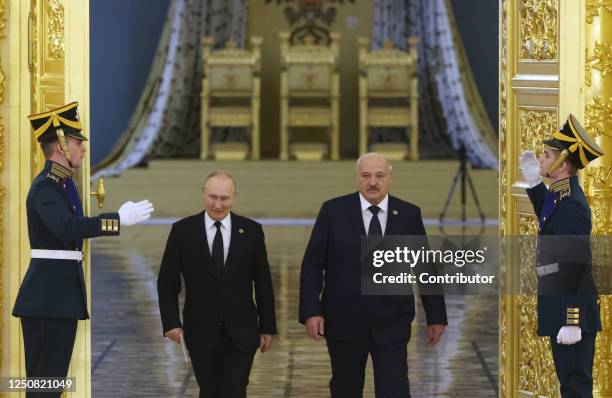 Russian President Vladimir Putin and Belarussian President Alexander Lukashenko enter the hall during the summit of Russian-Belarussian Supreme State...