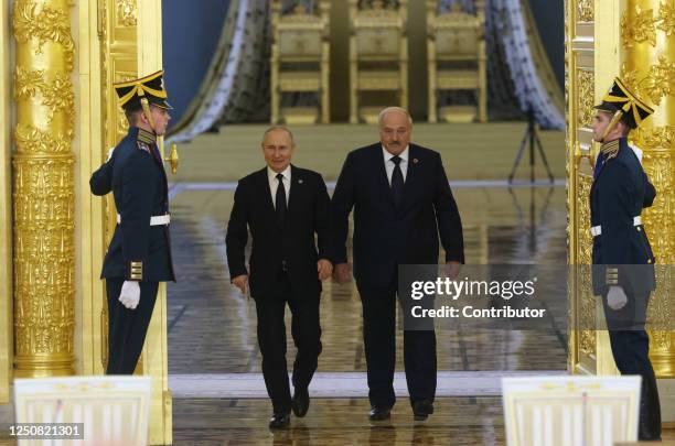 Russian President Vladimir Putin and Belarussian President Alexander Lukashenko enter the hall during the summit of Russian-Belarussian Supreme State...