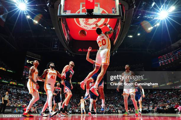 John Collins of the Atlanta Hawks dunks the ball against the Washington Wizards on April 5, 2023 at State Farm Arena in Atlanta, Georgia. NOTE TO...