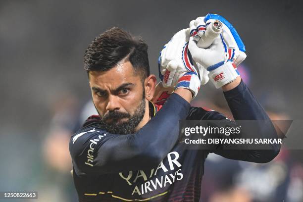 Royal Challengers Bangalore's Virat Kohli practices before the start of the Indian Premier League Twenty20 cricket match between Kolkata Knight...