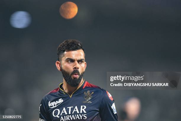 Royal Challengers Bangalore's Virat Kohli gestures before the start of the Indian Premier League Twenty20 cricket match between Kolkata Knight Riders...