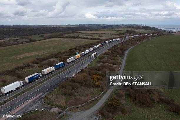 Freight lorries, HGVs and cars, queue on the A20 road towards the Port of Dover on April 6, 2023 as French demonstrators caused travel disruption on...