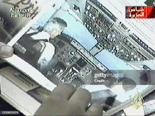 In this video grab taken from the Qatar-based Al-Jazeera satellite television station 09 September 2002, alleged militants described as Al-Qaeda...