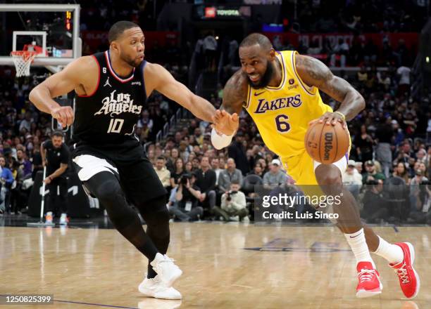 Los Angeles, CA Lakers forward LeBron James drives to basket against Clippers guard Eric Gordon in the third quarter Tuesday night, Apr. 5 at...
