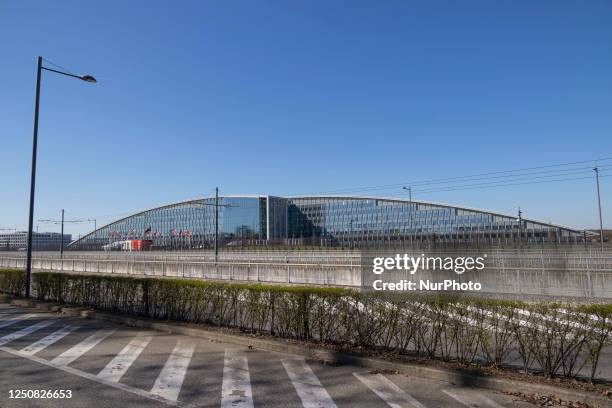 Headquarters of NATO. Flag raising ceremony as NATO adds Finland, the 31st member of the North Atlantic Alliance. The Flag of Finland, also called...