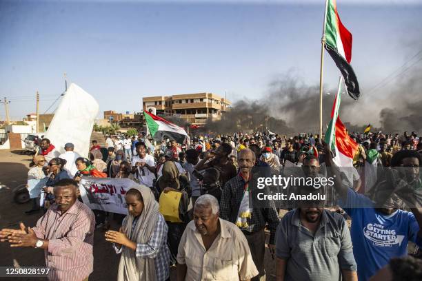 People gather to protest against framework agreement signed between the military and civilians, which aims to resolve the governance crisis that has...