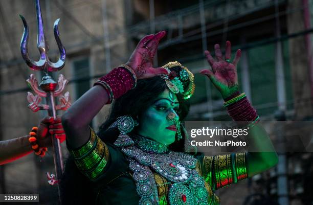 Woman dressed as Hindu Goddess Parvati as she participate in a cultural rally during Hanuman Jayanti celebration in Guwahati, Assam, India on 6 April...