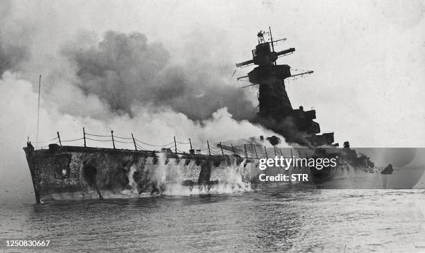 Picture of the German pocket battleship Admiral Graf Spee in fire and sinking, taken on 17 December 1939 in front of the port of Montevideo, Uruguay....