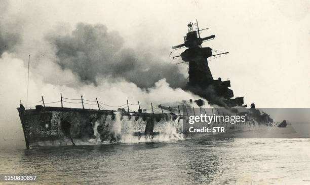 Picture taken on 17 December 1939 in front of the port of Montevideo, Uruguay of German pocket battleship Admiral Graf Spee in fire and sinking. The...