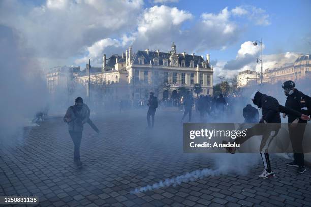 Protestor kicking a tear gas bomb back at the riot police during a protest against the government after pushing the pensions reform without a vote...